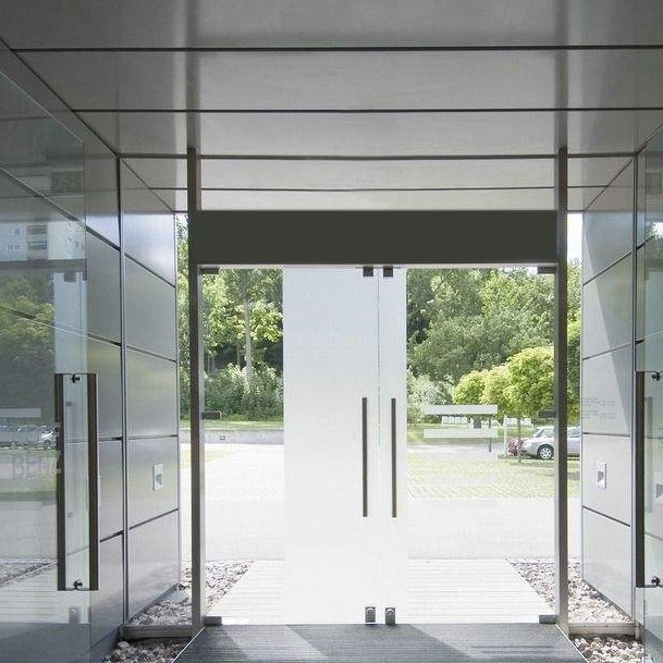 Glass entrance doorway with door furniture — a typical access-controlled entry