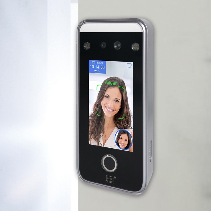 Face recognition terminal with dual camera and card reader on a white wall